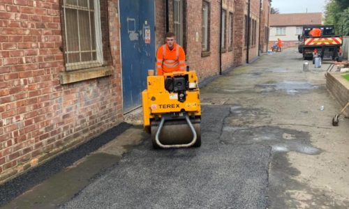 Road Roller working on factory yard repairs in Newcastle-Upon-Tyne, UKair in Newcastle-Upon-Tyne