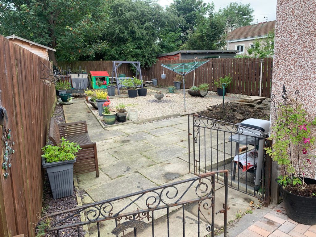 Old flagstone paved garden BEFORE refurbishment by Armstrong's Roads & Driveways 
