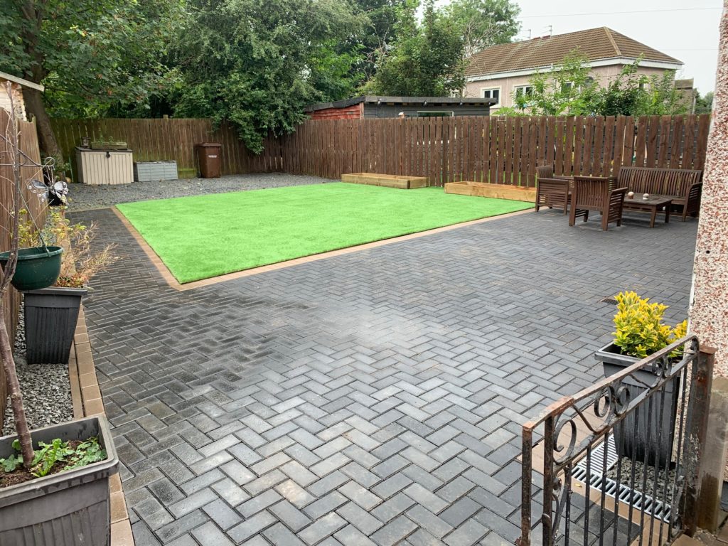 Contemporary suburban garden with block paving & Astroturf in Peebles Scotland EH45