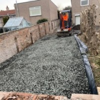 Sizeable domestic driveway we did in Edinburgh, Armstrong's mini digger prepping it ready for tarmac Min digger prepping a driveway in Edinburgh Scotland