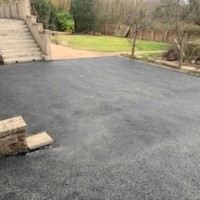 Turning area, tarmac is durable enough for heavy use by vehicles, and resistant to colder weather in Scotland. Tarmacked turning area, Scotland