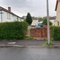 Time for a makeover: 'BEFORE' picture, Armstrong's Roads & Driveways, surfacing contractors, Scotland Scruffy Backyard entrance with wooden gates, Anniesland G13