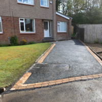 All done in a day, just needs a sweep. New tarmac driveway in G66, East Dunbartonshire by Armstrong's Roads & Driveways Completed new tarmac driveway in East Dunbartonshire