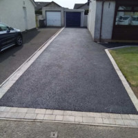 Smart contemporary driveways from Armstrong's Roads & Driveways, Darlington England, & Glasgow, Scotland Smart tarred drive with paved edging, Scotland