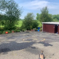 First impressions count! Uneven yard at a Livingston cattery prior to refurbishment by Scottish surfacing contractor Armstrong's Roads & Driveways Uneven concrete yard at a cattery in Scotland